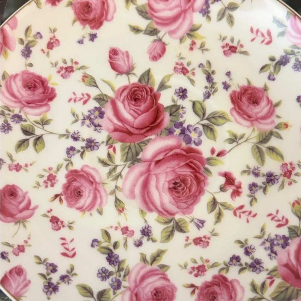 Three modern coordinating cup and saucer sets in shades of pink.
